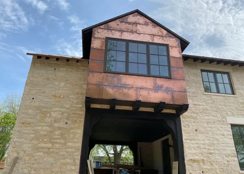 Copper metal panel facade on a stone building for Skylight Installation in Cleveland Heights