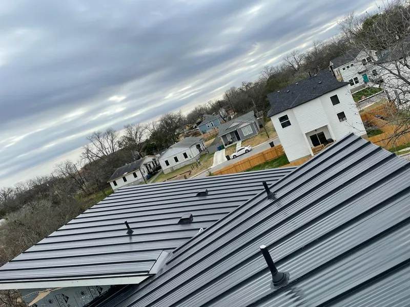 Standing seam metal roof panels with vents for Skylight Repair in Cleveland Heights